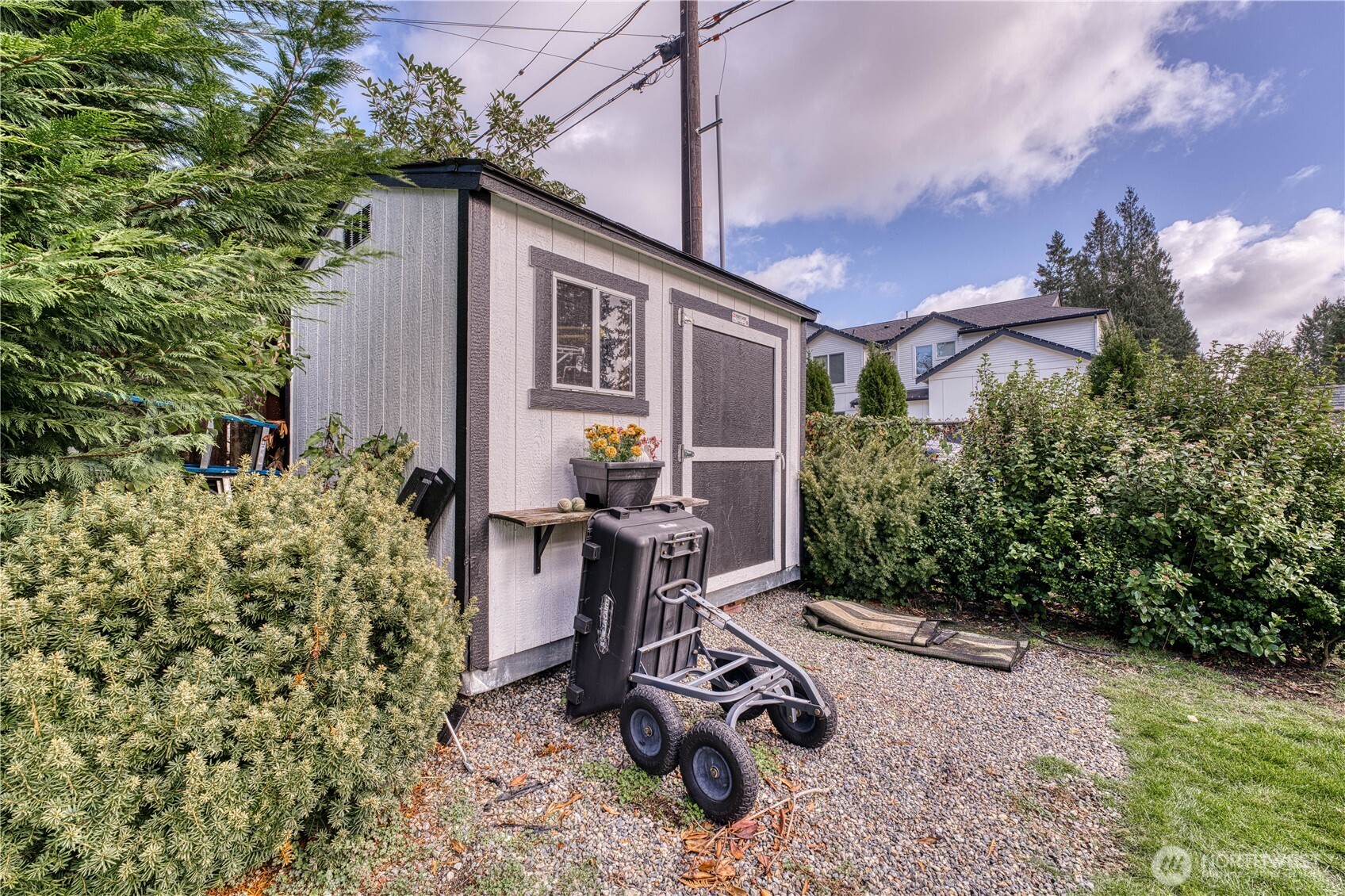 10536 Northeast 189th Street Bothell, WA 98011 - Photo 35 of 37 a view of a chair and table in the backyard