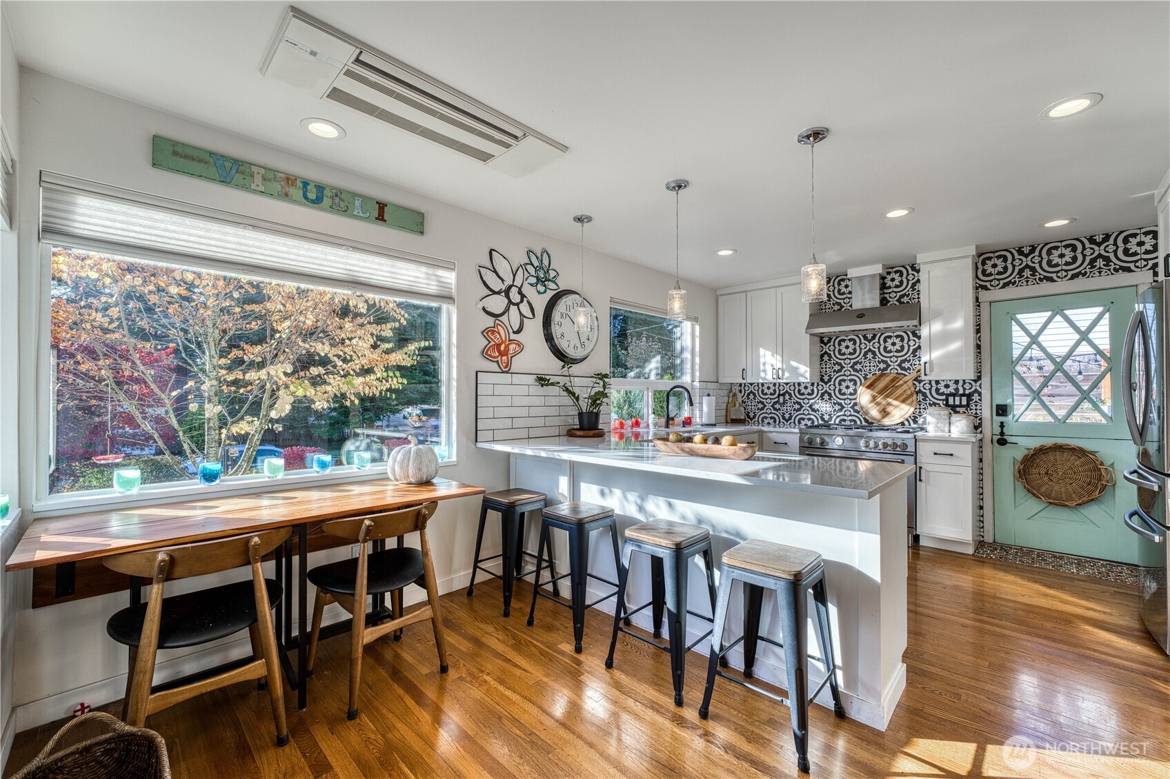 10536 Northeast 189th Street Bothell, WA 98011 - Photo 6 of 37 a view of a dining room with furniture window and wooden floor