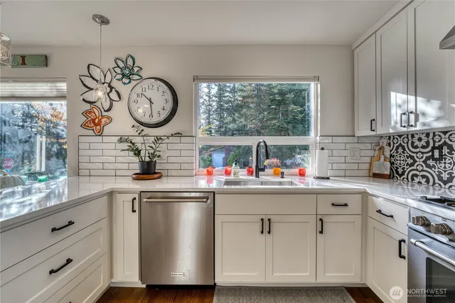 a kitchen with a sink and a stove