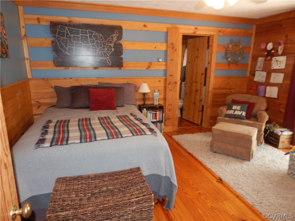 1451 Mill Road Henrico, VA 23231 - Photo 11 of 23 a bedroom with a bed and wooden floor