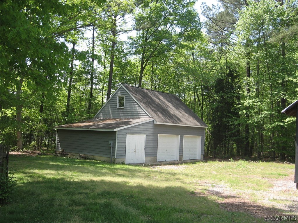 1451 Mill Road Henrico, VA 23231 - Photo 19 of 23 a house with a big yard and large trees