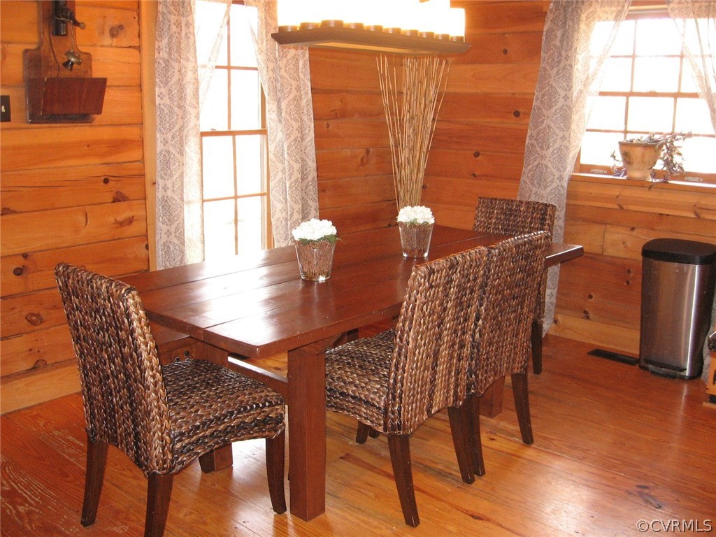 1451 Mill Road Henrico, VA 23231 - Photo 6 of 23 a view of a dining room with furniture and wooden floor