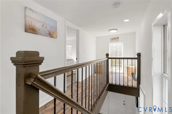a view of entryway and hall with a door