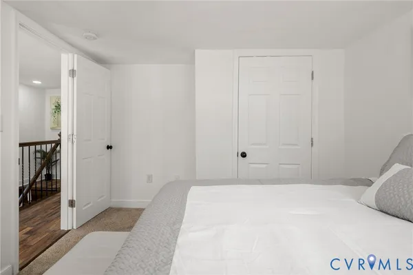 a bedroom with a bed and a walk in closet