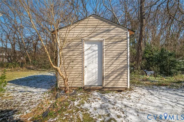 a view of a wooden door and a tree