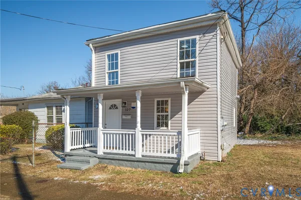 a front view of a house with a porch