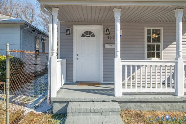 a front view of a house with a outdoor space