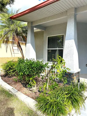 a kitchen with a sink and white cabinets