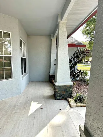 a large kitchen with granite countertop a large counter top stainless steel appliances and cabinets