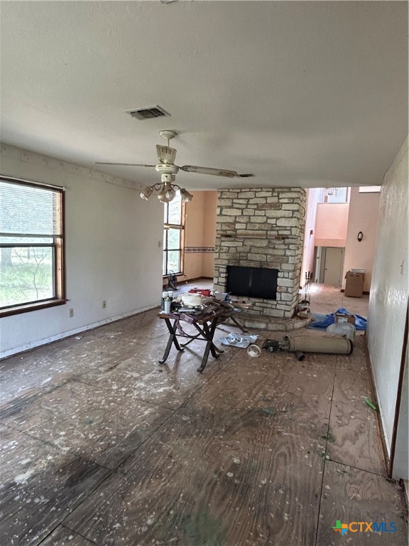3849 Zion Hill Road Seguin, TX 78155 - Photo 14 of 35 a living room with furniture and a fireplace