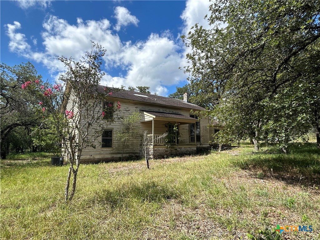3849 Zion Hill Road Seguin, TX 78155 - Photo 3 of 35 a view of house with a big yard and potted plants