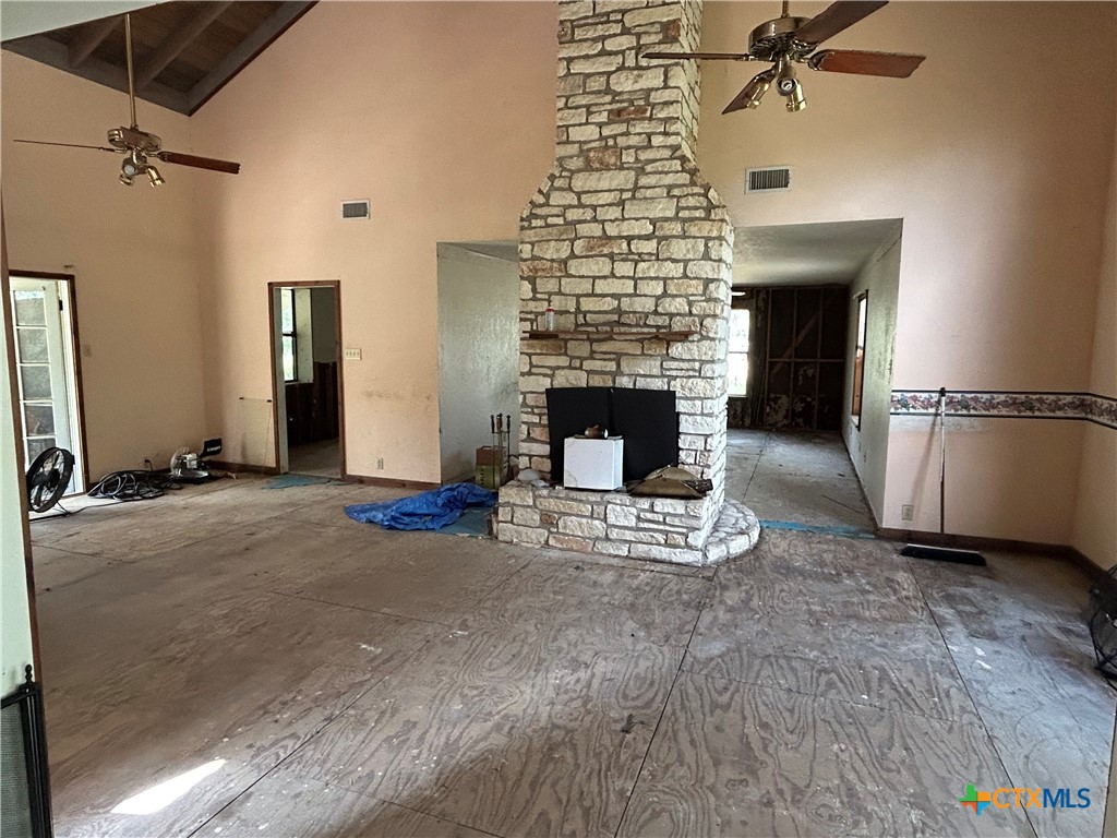 3849 Zion Hill Road Seguin, TX 78155 - Photo 7 of 35 a living room with furniture and a fireplace