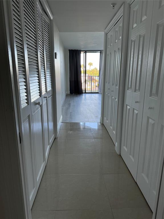 859 Jeffery Street, Unit 214 Boca Raton, FL 33487 - Photo 18 of 32 a view of a hallway with windows