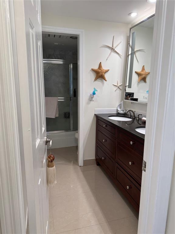 859 Jeffery Street, Unit 214 Boca Raton, FL 33487 - Photo 21 of 32 a bathroom with a sink and mirror