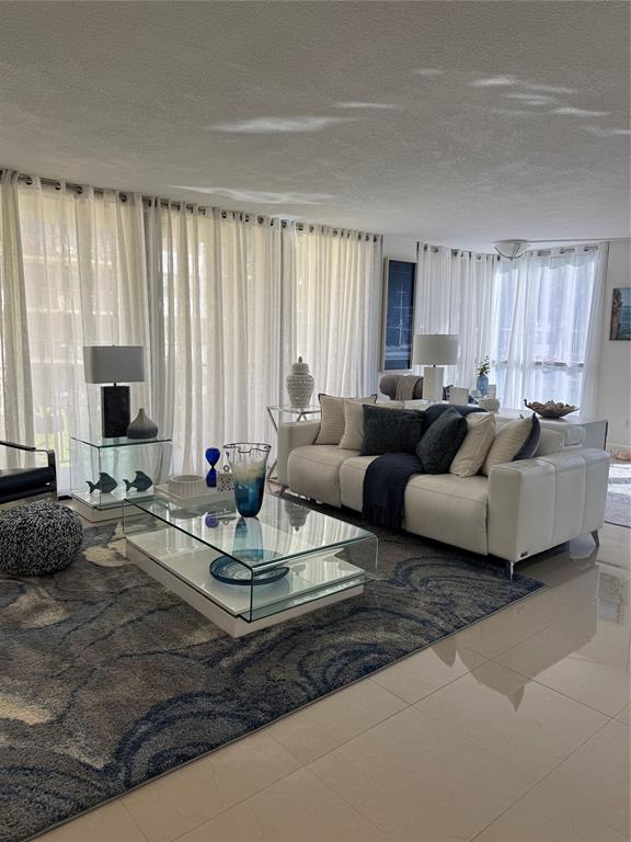 859 Jeffery Street, Unit 214 Boca Raton, FL 33487 - Photo 22 of 32 a living room with furniture and a large window