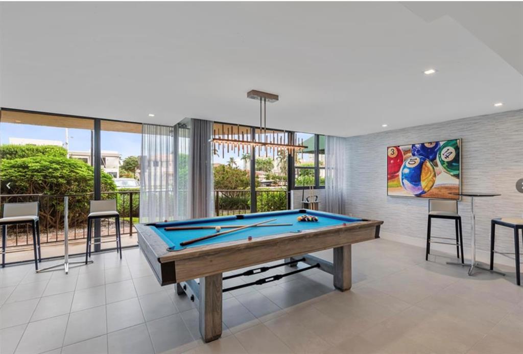 859 Jeffery Street, Unit 214 Boca Raton, FL 33487 - Photo 29 of 32 a room with furniture pool table and windows