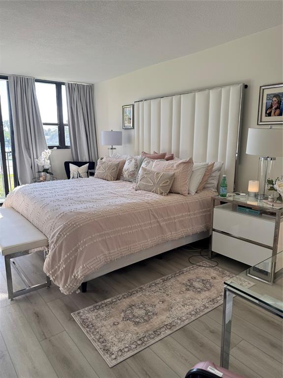 859 Jeffery Street, Unit 214 Boca Raton, FL 33487 - Photo 32 of 32 a bedroom with a bed and a window