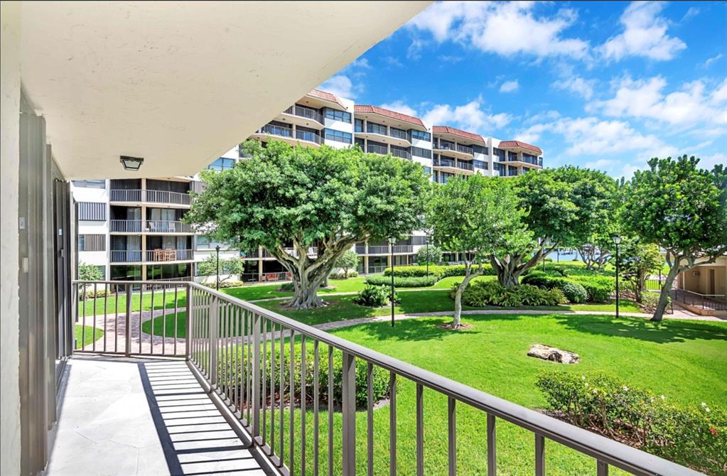 859 Jeffery Street, Unit 214 Boca Raton, FL 33487 - Photo 9 of 32 a view of a house with a yard