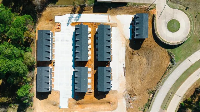 an aerial view of a house with outdoor space