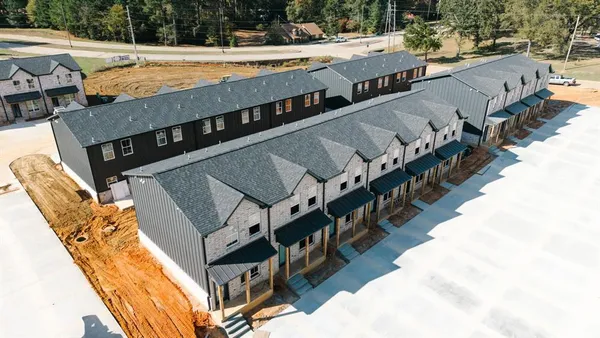 a view of a swimming pool with seating space