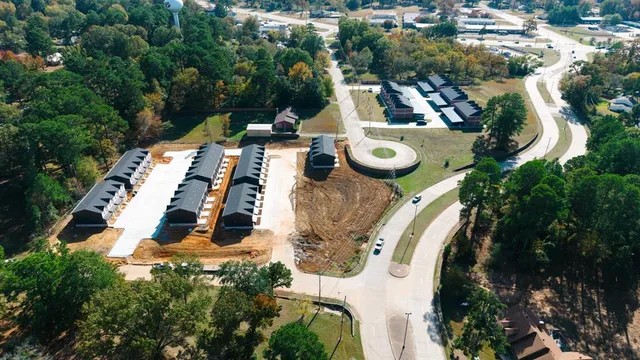 an aerial view of a house with outdoor space