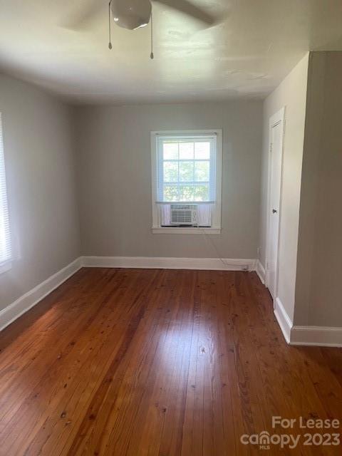 320 Orange Street Charlotte, NC 28205 - Photo 4 of 14 an empty room with wooden floor and windows