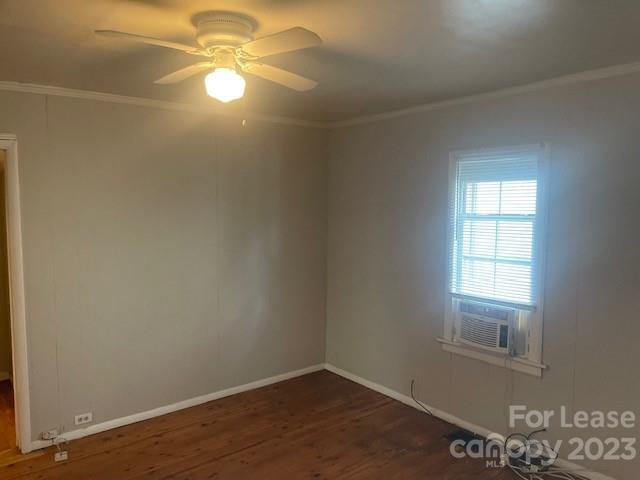 320 Orange Street Charlotte, NC 28205 - Photo 6 of 14 an empty room with a window and a fan