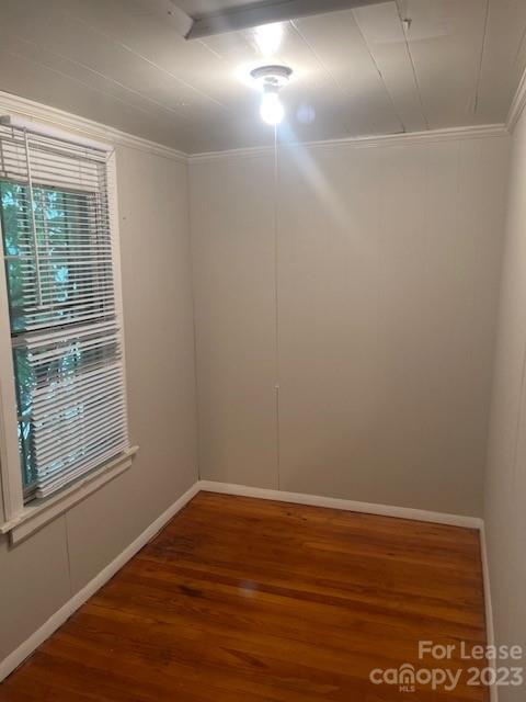 320 Orange Street Charlotte, NC 28205 - Photo 8 of 14 a view of an empty room with wooden floor and a window