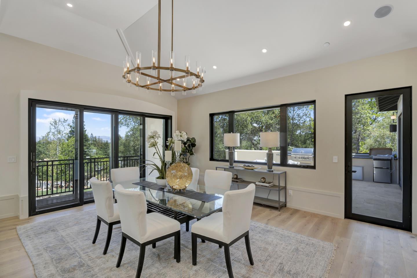 15941 Viewfield Road Monte Sereno, CA 95030 - Photo 11 of 70 a dining room with furniture a chandelier and wooden floor