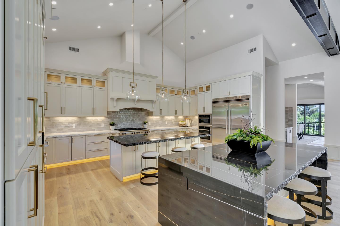 15941 Viewfield Road Monte Sereno, CA 95030 - Photo 14 of 70 a kitchen with stainless steel appliances kitchen island granite countertop a sink and cabinets
