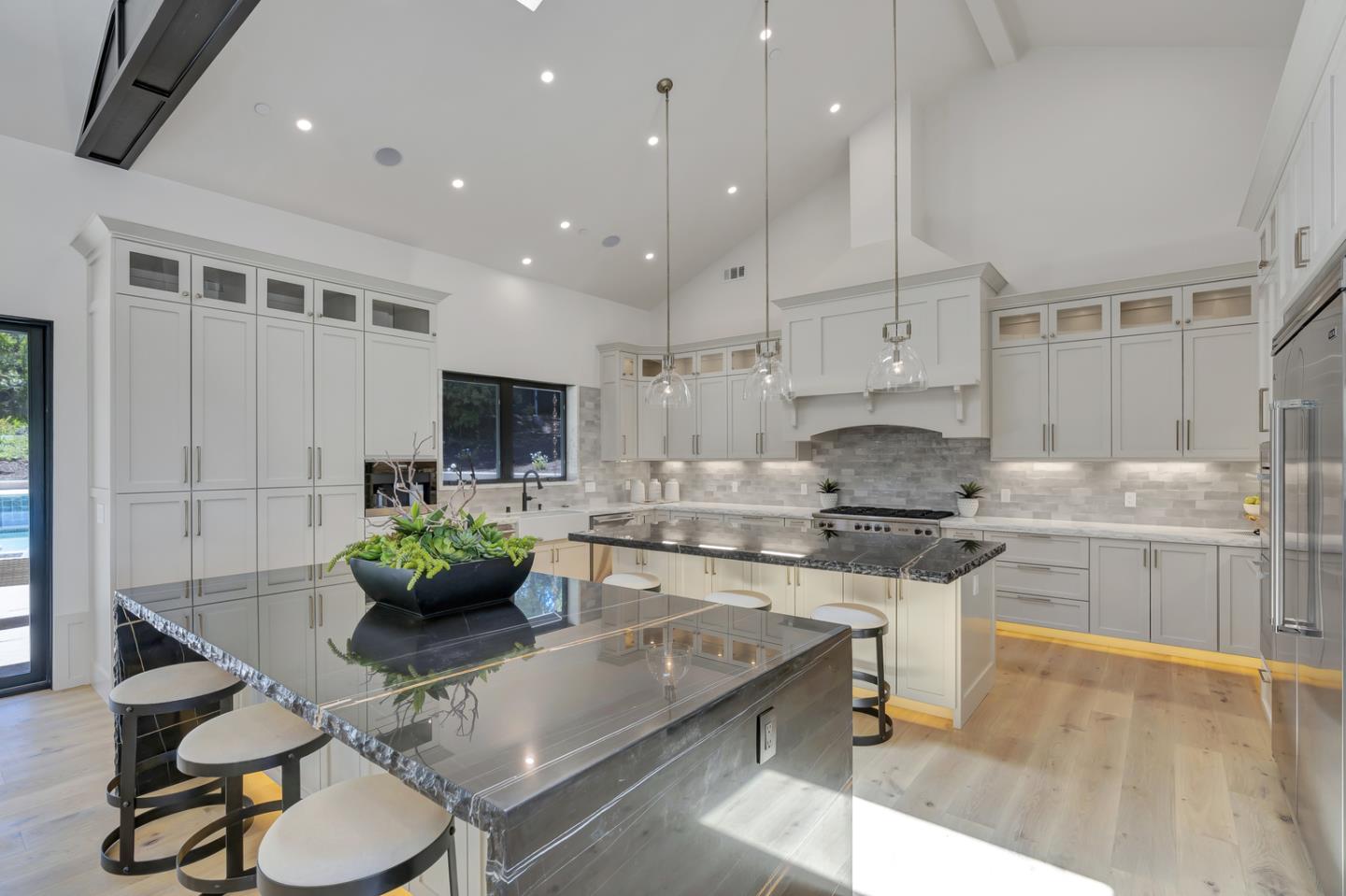 15941 Viewfield Road Monte Sereno, CA 95030 - Photo 15 of 70 a kitchen with stainless steel appliances kitchen island granite countertop a sink and cabinets