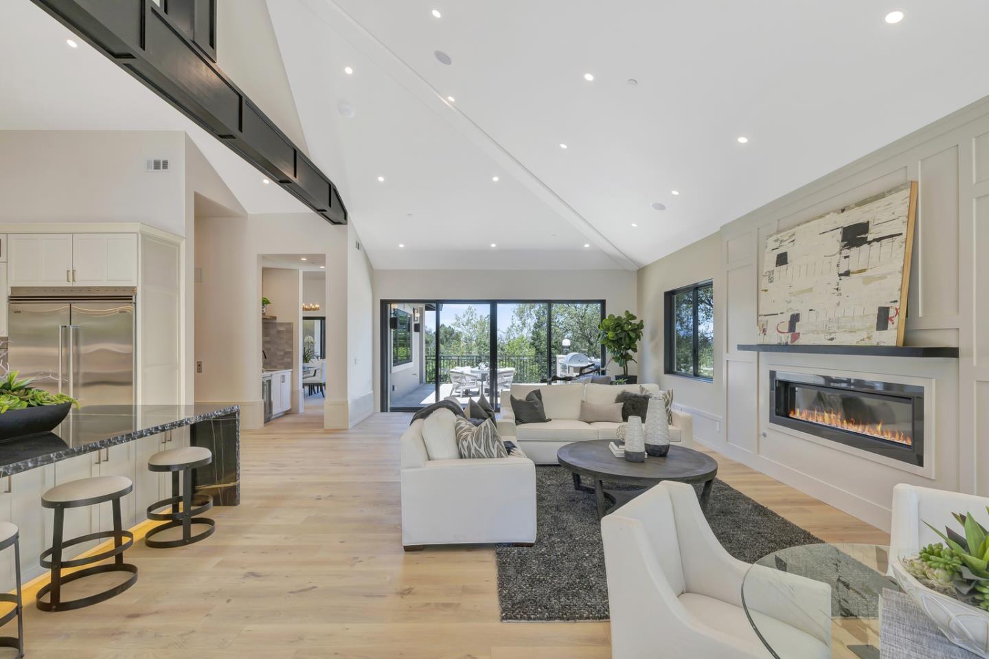 15941 Viewfield Road Monte Sereno, CA 95030 - Photo 21 of 70 a living room with fireplace furniture and a large window