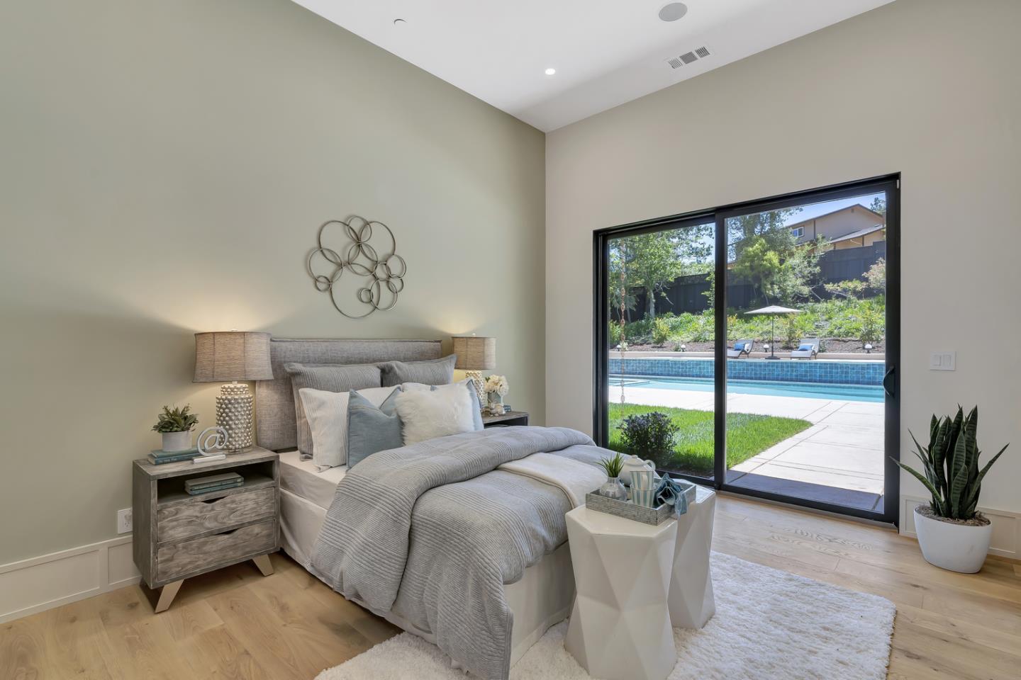 15941 Viewfield Road Monte Sereno, CA 95030 - Photo 28 of 70 a bedroom with furniture and a large window