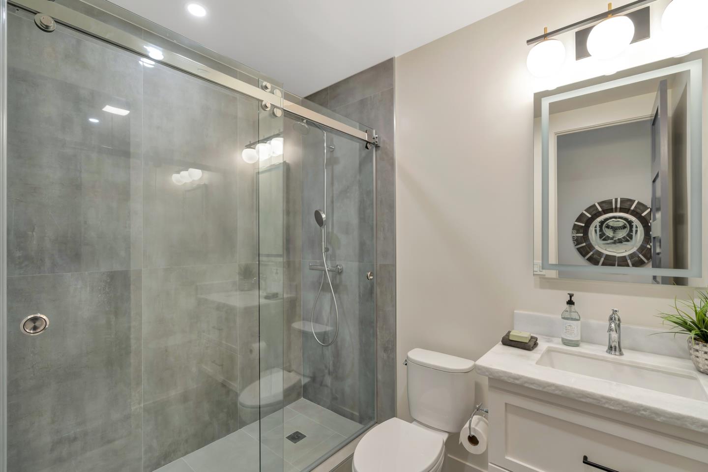 15941 Viewfield Road Monte Sereno, CA 95030 - Photo 55 of 70 a bathroom with a sink a toilet and shower