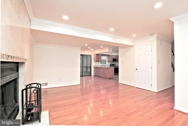 a view of kitchen with furniture and refrigerator