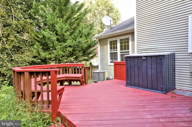 a view of a roof deck with wooden floor and seating space