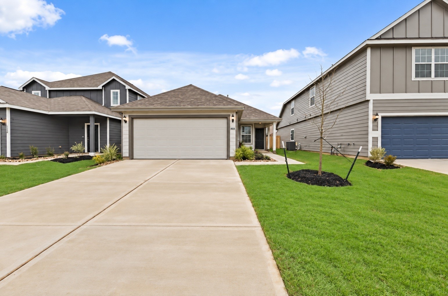 1392 Mount Blanc Path Conroe, TX 77301 - Photo 19 of 20 Front of house with a 2 car garage - AI Enhanced