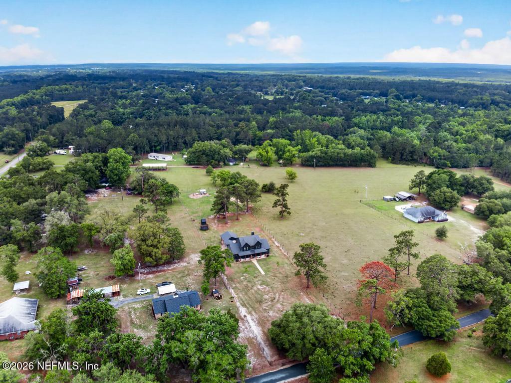 2955 Carroll Corner Road Hilliard, FL 32046 - Photo 96 of 106 an aerial view of lake residential house with swimming pool and green space