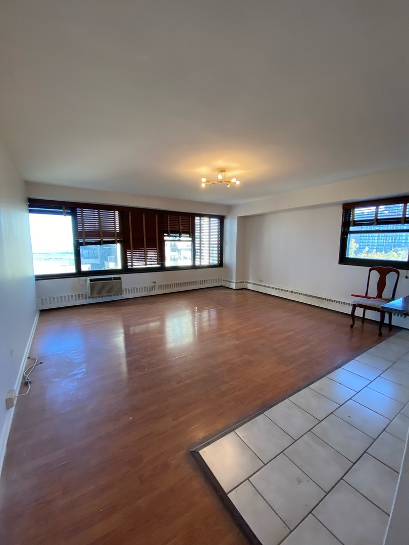 6030 North Sheridan Road, Unit 602 Chicago, IL 60660 - Photo 3 of 14 a view of a livingroom with wooden floor