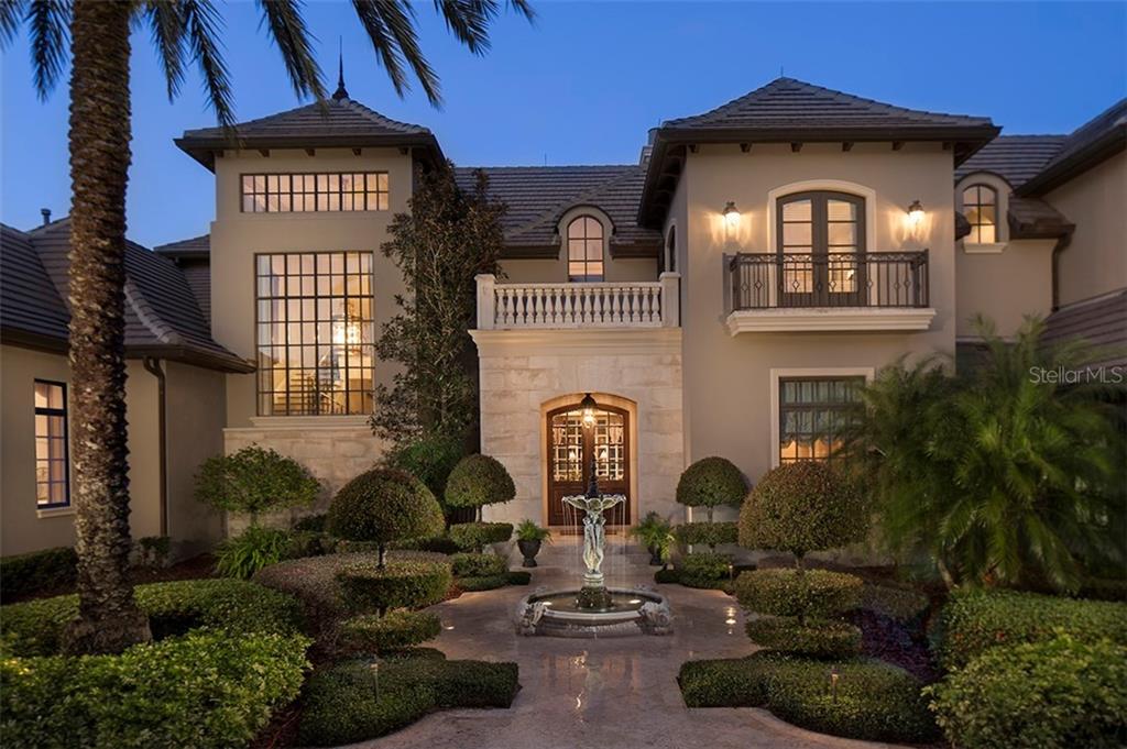 9921 Lake Louise Drive Windermere, FL 34786 - Photo 1 of 1 a front view of a house with garden