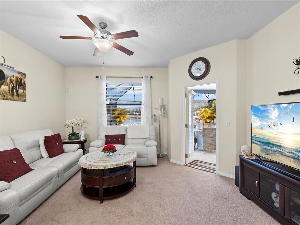 1716 Hadden Hall Place Trinity, FL 34655 - Photo 15 of 75 a living room with furniture and window