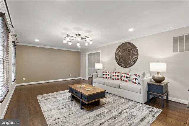 a kitchen with stainless steel appliances granite countertop a sink refrigerator and cabinets