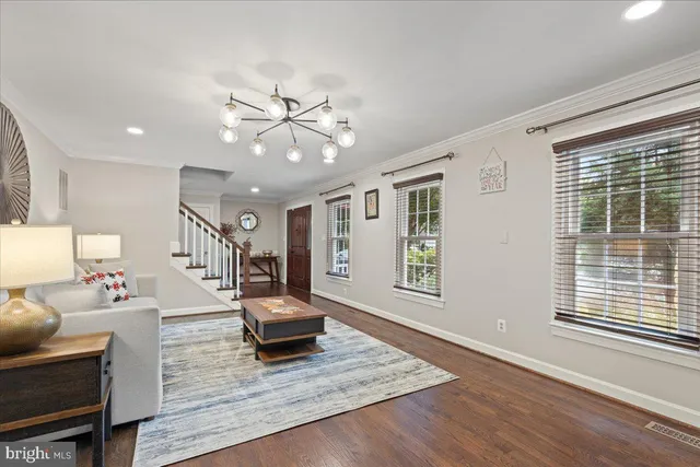 a kitchen with granite countertop a sink a stove and cabinets