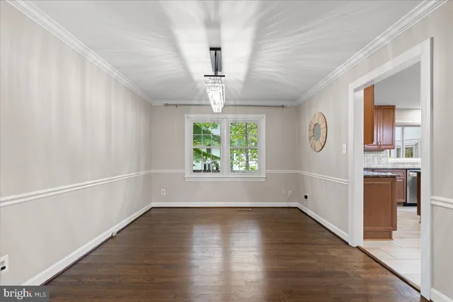 a kitchen with a refrigerator a oven a sink and a stove