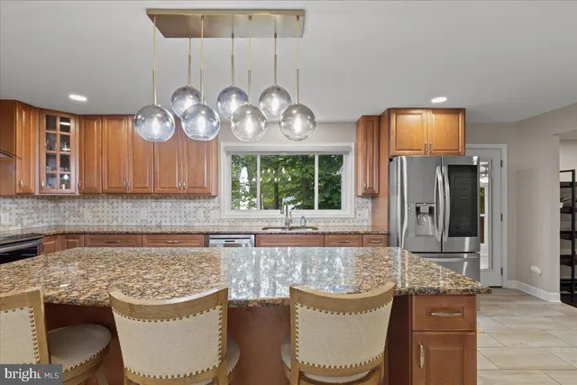 a bedroom with a large bed and a flat screen tv