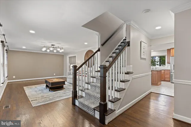 a view of a bedroom with furniture window and wooden floor