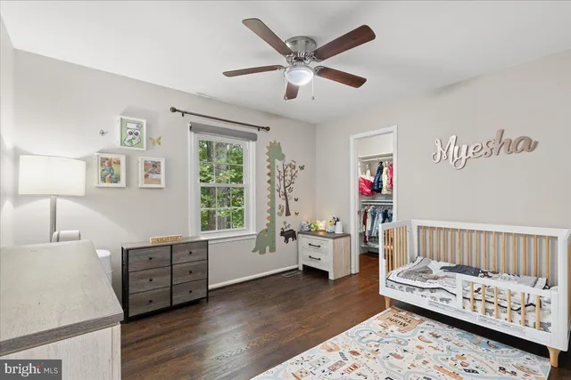 a utility room with granite countertop cabinets washer and dryer