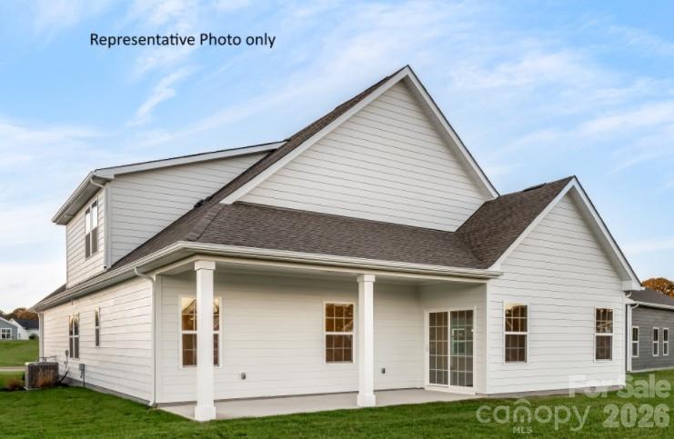 2023 Trout Brk Road, Unit 3230 Indian Trail, NC 28079 - Photo 8 of 10 a front view of a house with a yard
