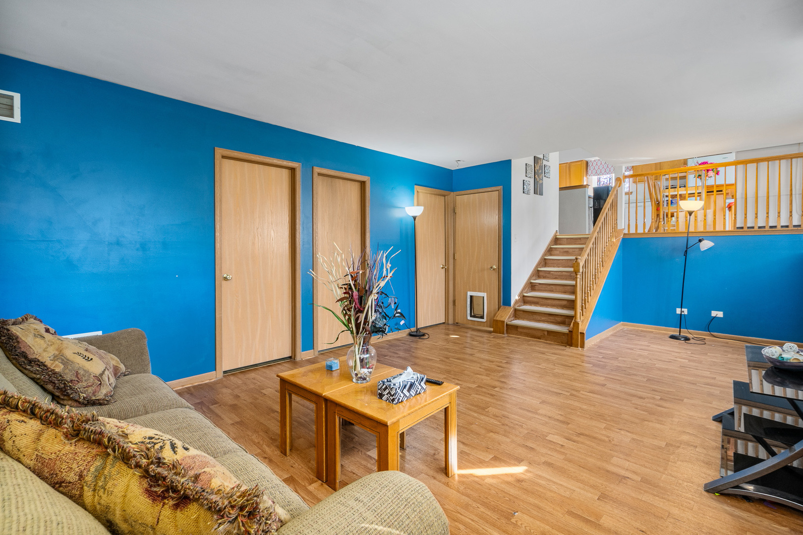5221 West Mulberry Lane Monee, IL 60449 - Photo 12 of 32 a living room with furniture a rug and a wooden floor