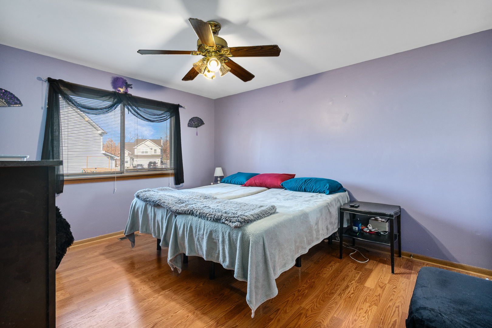 5221 West Mulberry Lane Monee, IL 60449 - Photo 15 of 32 a bedroom with a bed and a chandelier